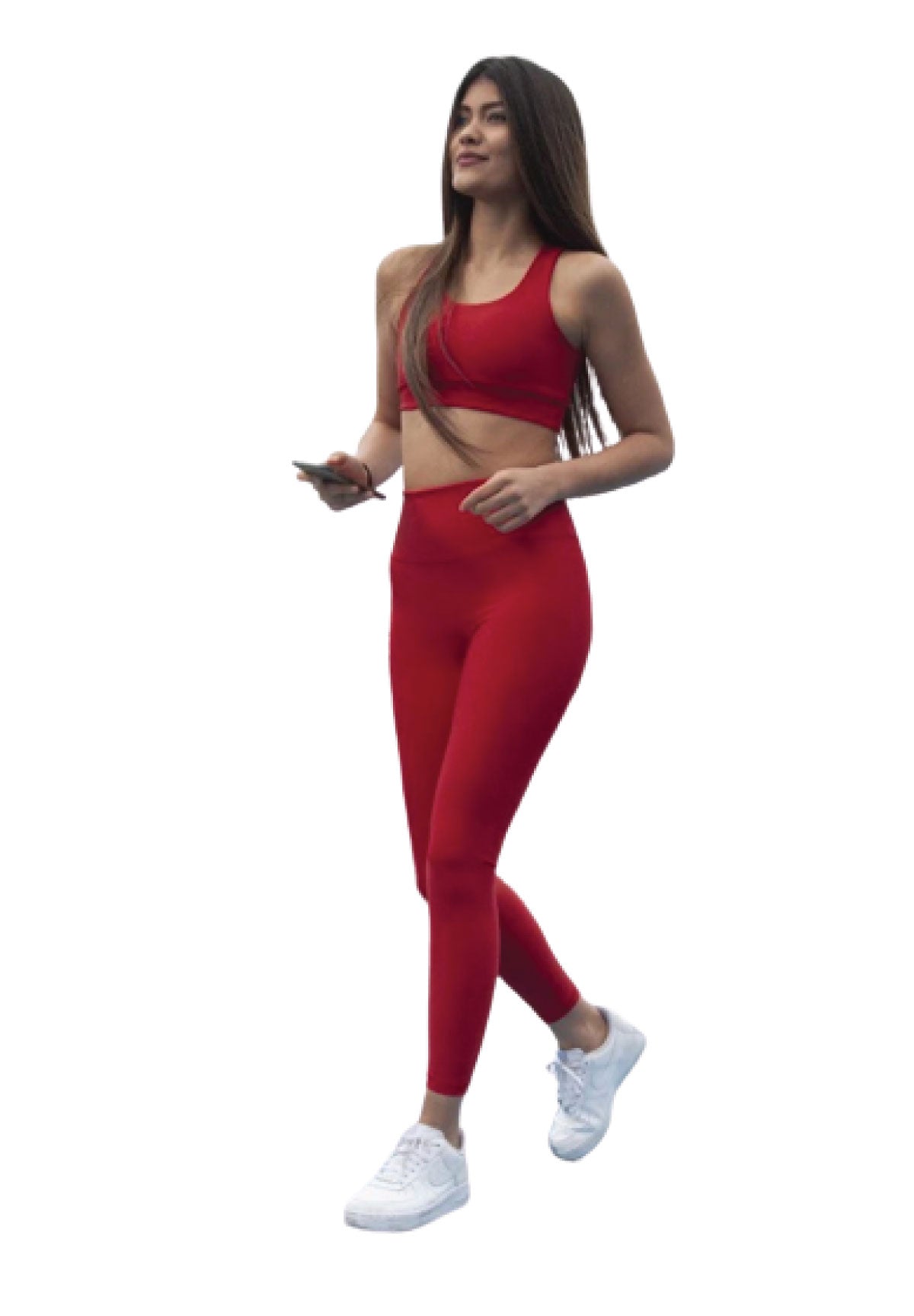 Eine Frau in Lisminas 252 Extra High Waist Leggings geht selbstbewusst mit einem Telefon und weißen Turnschuhen auf einem weißen Hintergrund.
